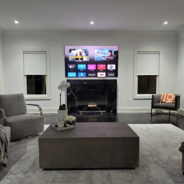 Modern living room with blackout roller shades and sleek minimalist design