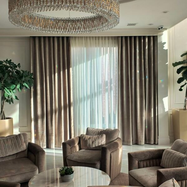 Modern living room with layered drapery installed on a Euro Track curtain system